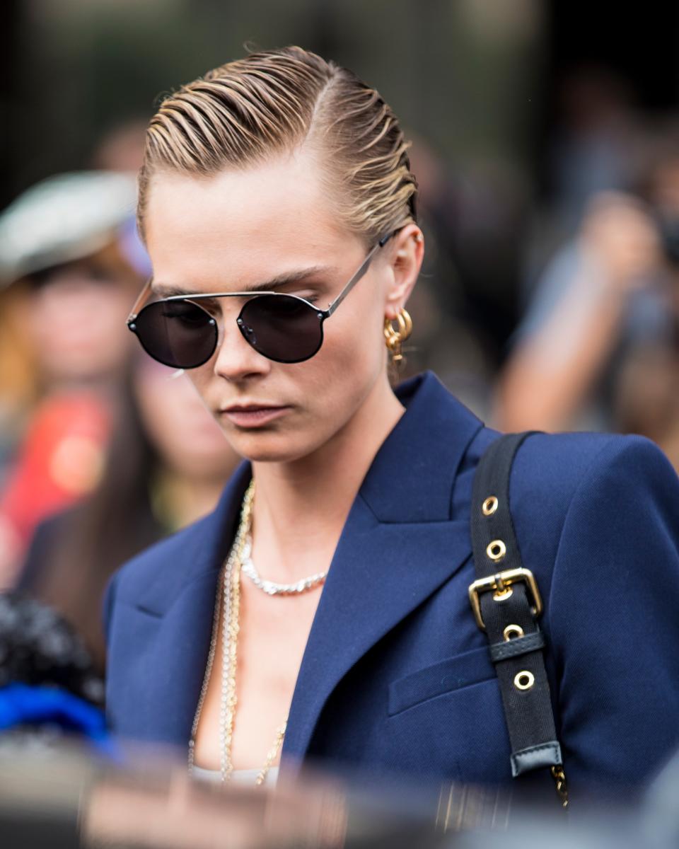 While Cara Delevingne walked the Balmain fashion show during Paris Fashion Week on Friday, rumored girlfriend Ashley Benson looked on from the audience.