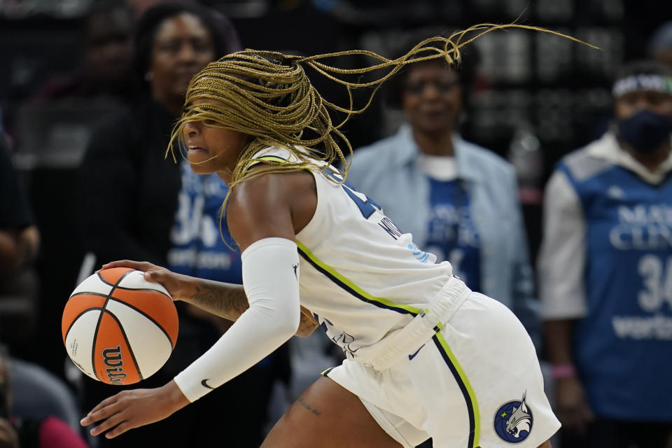Minnesota Lynx guard Tiffany Mitchell dribbles down the court during the second half of a WNBA basketball game against the Los Angeles Sparks, Sunday, June 11, 2023, in Minneapolis. (AP Photo/Abbie Parr)