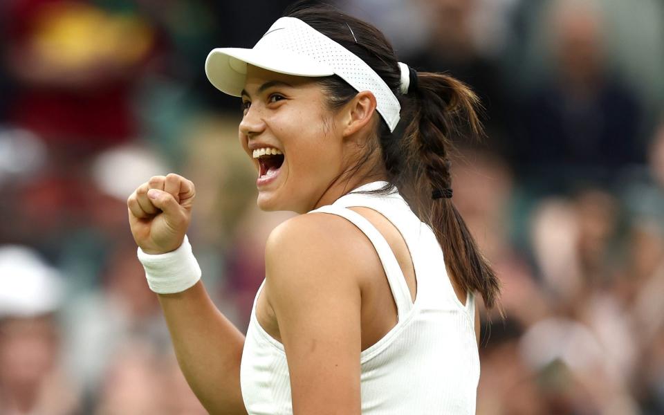 Emma Raducanu celebrates beating Elise Mertens