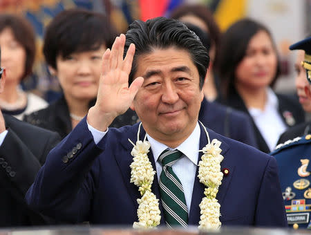 Japanese Prime Minister Shinzo Abe waves upon arrival for a state visit in metro Manila, Philippines January 12, 2017. REUTERS/Romeo Ranoco