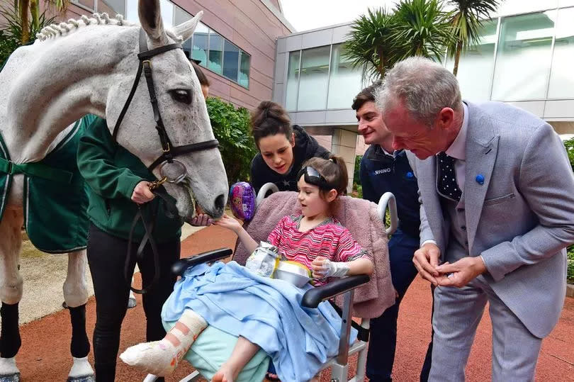 Ella, six, meets Neptune Collonges at Alder Hey