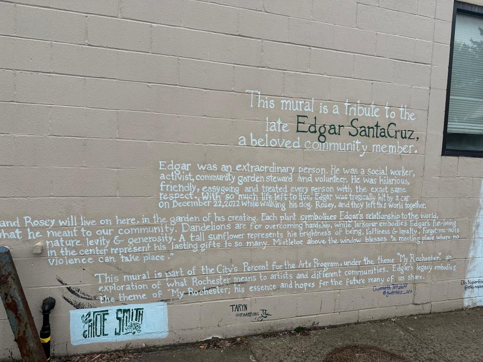 The new mural on the side of the Lincoln Branch Library at 851 Joseph Avenue by artist Chloe Smith is a memorial tribute to Edgar SantaCruz, a beloved community member who was struck and killed, along with his dog, by a hit-and-run driver in December 2022.