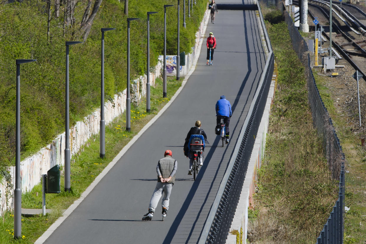 Berlin, Germany - April 16: Cyclists ride on a bicycle road along a railway on April 16, 2019 in Berlin, Germany. (Photo by Thomas Trutschel/Photothek via Getty Images)