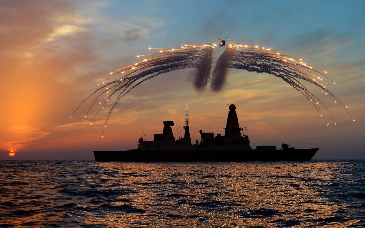 An RAF Lynx helicopter fires defensive flares over HMS Dragon. Russia accused the ship of ignoring warnings not to enter its waters