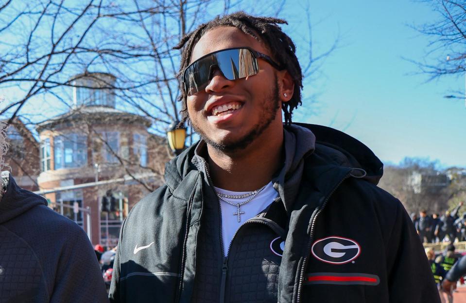 Jan 14, 2023; Athens, GA, USA; Georgia Bulldogs offensive lineman Devin Willock (77) at the national championship celebration at Sanford Stadium. / Credit: Brett Davis-USA TODAY Sports via Reuters