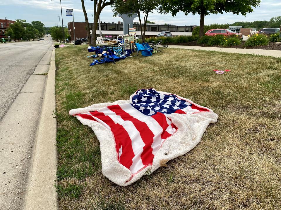 An American flag blanket was left in downtown Highland Park, Ill., on July 4.