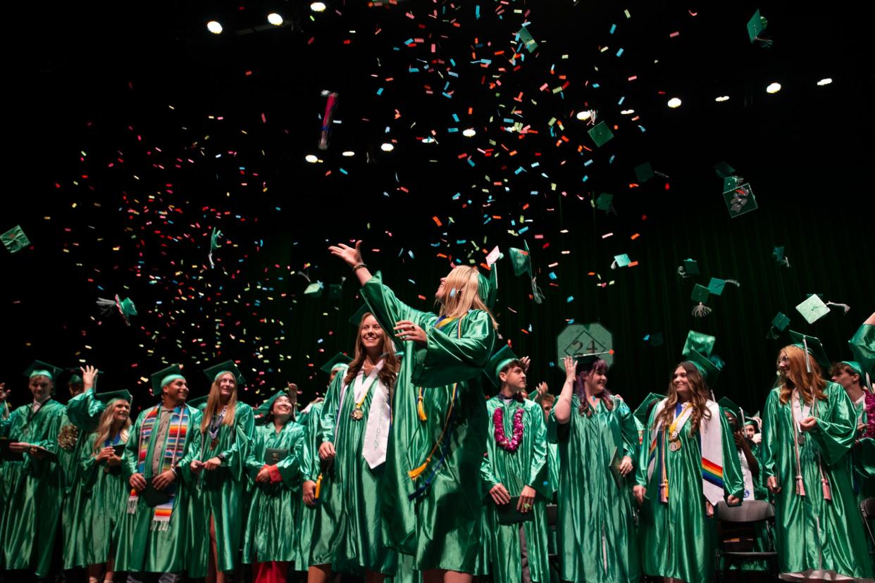Sheldon High School grads Kat Gilbert, center left, and Meredith Movalson lead their classmates in celebration at the conclusion of their graduation ceremony at the Hult Center in Eugene Monday, June 10, 2024.