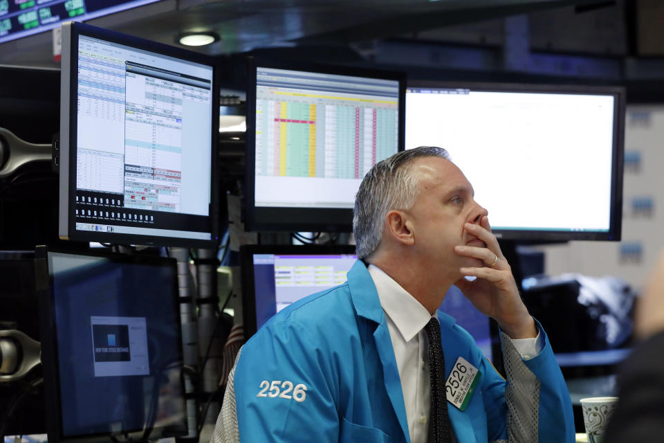 FILE- In this March 11, 2019, file photo specialist Donald Himpele Jr. works at his post on the floor of the New York Stock Exchange. The U.S. stock market opens at 9:30 a.m. EDT on Friday, May 10. (AP Photo/Richard Drew, File)