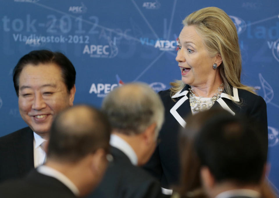 U.S. Secretary of State Hillary Rodham Clinton reacts as she meets fellow leaders for the group photo on the final day of the APEC summit in Vladivostok, Russia, Sunday, Sept. 9, 2012. (AP Photo/Mikhail Metzel)