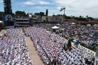 Catholics participate in a mass celebrating the beatification of archbishop Oscar Romero at San Salvador's main square on May 23, 2015