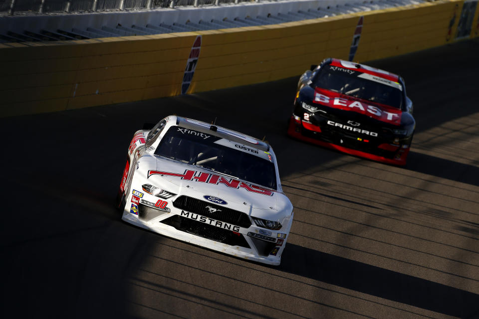 LAS VEGAS, NEVADA - SEPTEMBER 14: Cole Custer, driver of the #00 Haas Automation Ford, leads Tyler Reddick, driver of the #2 TAME the BEAST Chevrolet,  during the NASCAR Xfinity Series Rhino Pro Trucks Outfitters 300 at Las Vegas Motor Speedway on September 14, 2019 in Las Vegas, Nevada. (Photo by Jonathan Ferrey/Getty Images)