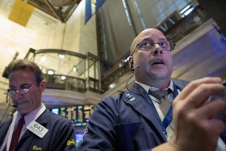 Traders work on the floor of the New York Stock Exchange October 22, 2015. REUTERS/Brendan McDermid