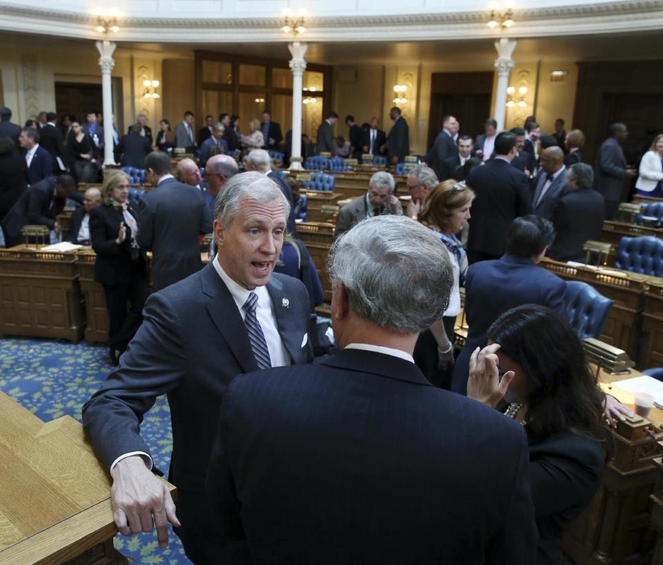 FILE - In this Thursday May 5, 2016 file photo, New Jersey Assemblyman John S. Wisniewski, D-Sayreville, N.J., center left, speaks with colleagues in the Assembly Chamber in Trenton, N.J. Governor's races this year in Virginia and New Jersey are unfolding in ways strikingly similar to the turbulent 2016 presidential campaign. Wisniewski is casting himself as a Bernie Sanders-style insurgent, even though he has been in office for two decades and served as state party chairman. (AP Photo/Mel Evans, File)