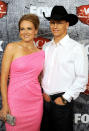 Songstress Jewel looked Hollywood glam in her glittery pink one-shoulder frock … which made up for hubby Ty Murray’s boring jeans, white button-down, and black cowboy hat … otherwise known as the male country star’s go-to uniform!