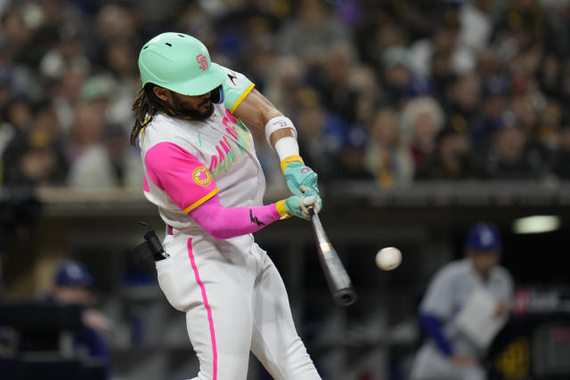 San Diego Padres' Fernando Tatis Jr. wears pink cleats as he