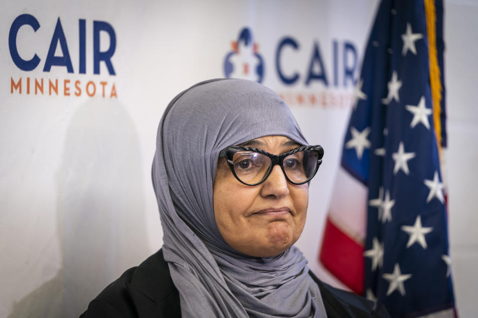 Aida Shyef Al-Kadi, of St. Louis Park, attends a press conference at CAIR-MN headquarters in Minneapolis on Tuesday, December 17, 2019. Al-Kadi reached a settlement with Ramsey County for $120,000 after claiming religious discrimination after being forced to remove her hijab for a booking photo and go without a hijab for a time while in jail. (Leila Navidi/Star Tribune via AP)