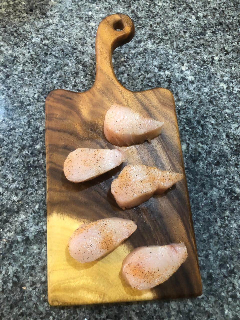 Wahoo medallions seasoned with Old Bay and olive oil.