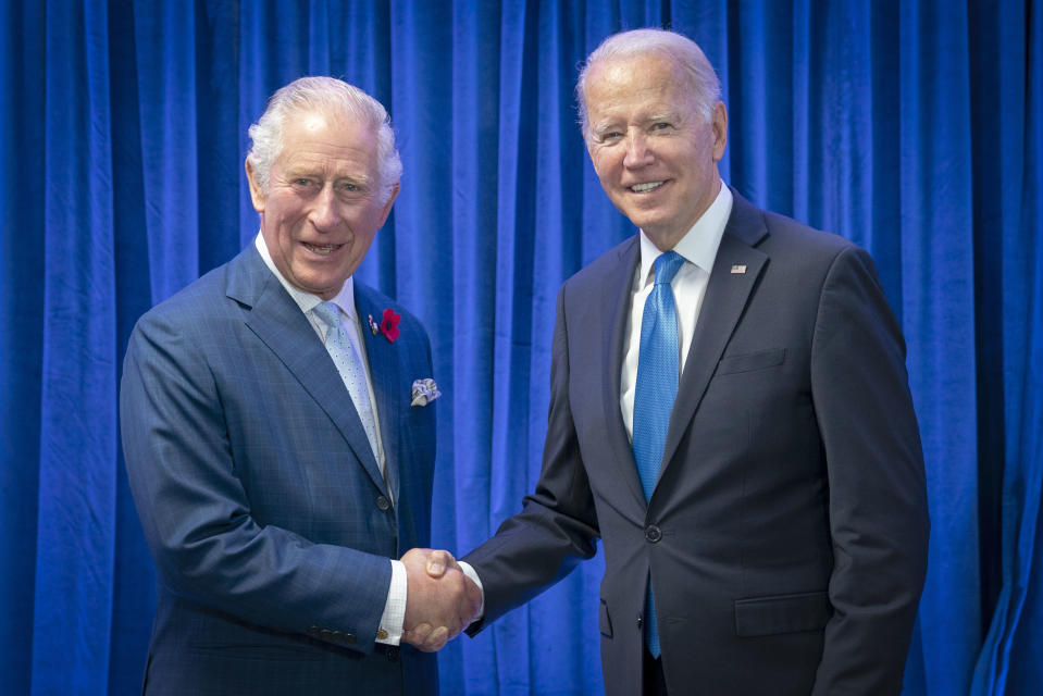 FILE - Britain's Prince Charles, left, greets President of the United States Joe Biden ahead of their bilateral meeting during the Cop26 summit at the Scottish Event Campus (SEC) in Glasgow, Scotland, Tuesday, Nov. 2, 2021. Biden will head to Europe next week for a three-country swing in an effort to bolster the international coalition against Russian aggression as the war in Ukraine continues well into its second year. The U.S. president will begin his trip to the continent in London, where he will meet with King Charles III. (Jane Barlow/Pool Photo via AP, File)