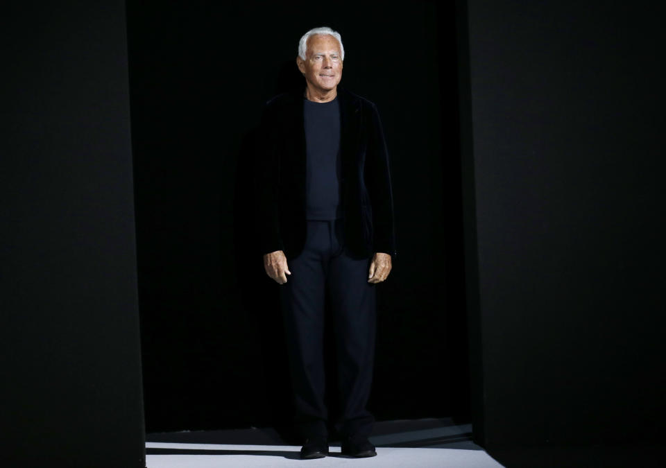 Italian fashion designer Giorgio Armani acknowledges the audience after presenting his Emporio Armani men's Fall-Winter 2013-14 collection, part of the Milan Fashion Week, unveiled in Milan, Italy, Monday, Jan. 14, 2013. (AP Photo/Antonio Calanni)