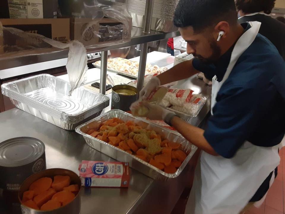 Salvation Army Modesto Corps officer Ray Jimenez prepares the sweet potatoes Wednesday, Nov. 23, 2022, at Modesto Centre Plaza for Thanksgiving.