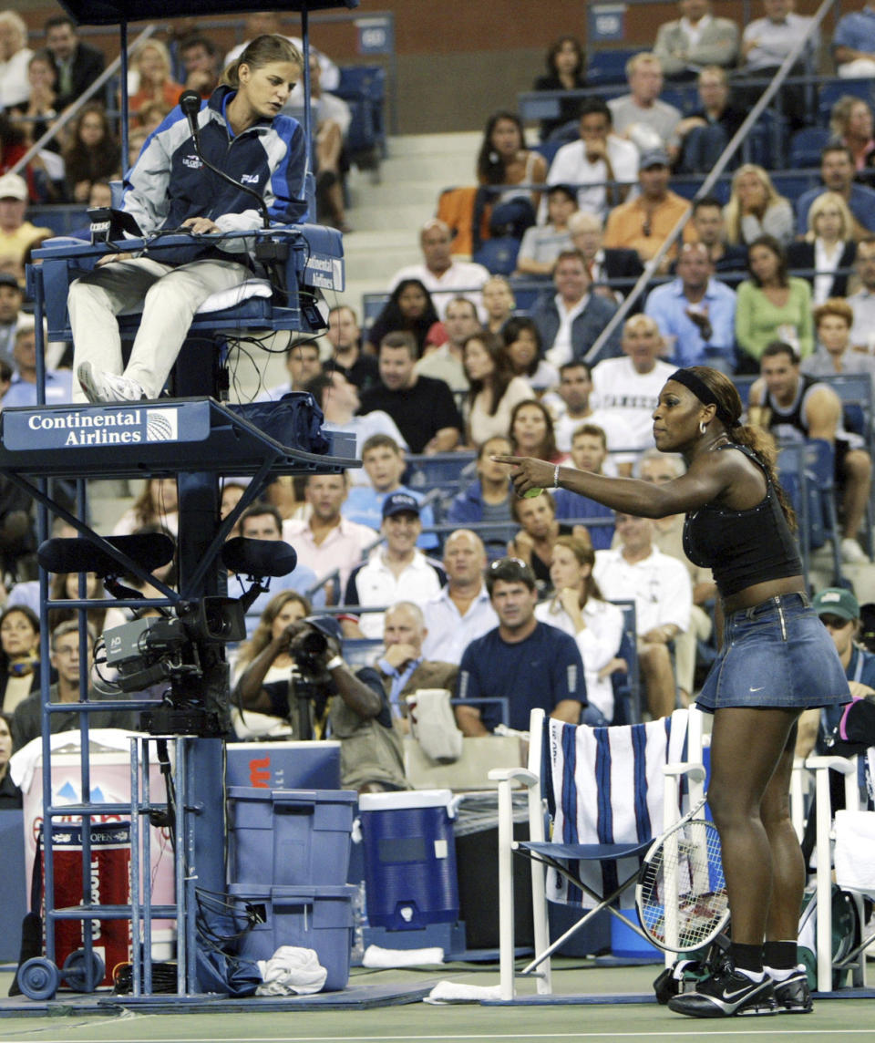 FILE - In this Tuesday, Sept. 7, 2004, file photo, Serena Williams, right, argues with chair umpire Mariana Alves during her match with Jennifer Capriati at the U.S. Open in New York. Williams’ dispute with the chair umpire during the 2018 U.S. Open final is the latest issue she’s had with match officials at the Grand Slam tournament. (AP Photo/Kathy Willens, File)