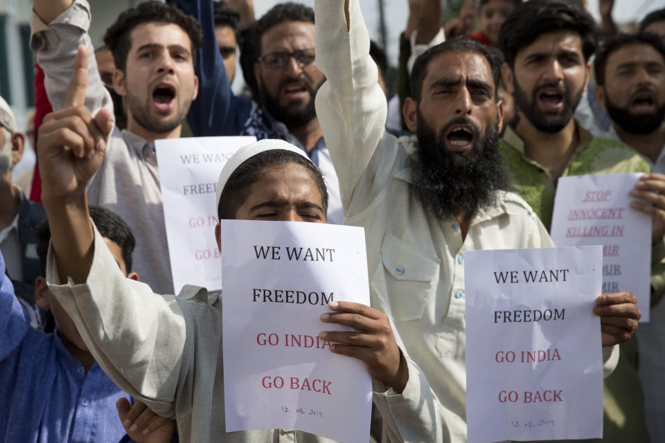 Kashmiri Muslims shout slogans during a protest after Eid prayers in Srinagar, Indian controlled Kashmir, Monday, Aug. 12, 2019. Troops in India-administered Kashmir allowed some Muslims to walk to local mosques alone or in pairs to pray for the Eid al-Adha festival on Monday during an unprecedented security lockdown that still forced most people in the disputed region to stay indoors on the Islamic holy day. (AP Photo/ Dar Yasin)