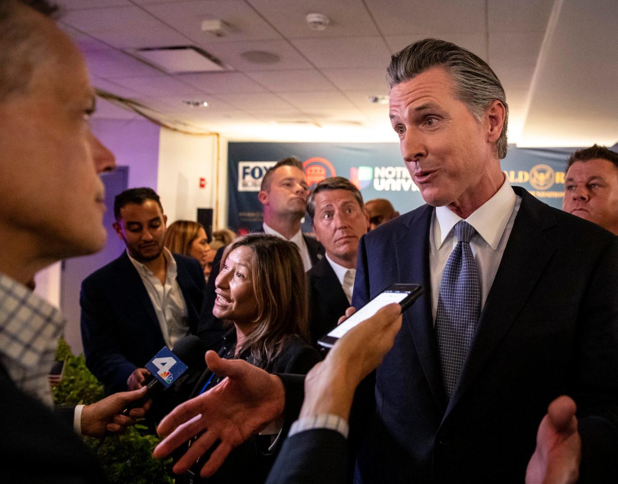 Gov. Gavin Newsom speaks to media in the spin room after the Republican presidential debate at the Ronald Reagan Presidential Library in Simi Valley, Calif., Wednesday, Sept. 27, 2023.