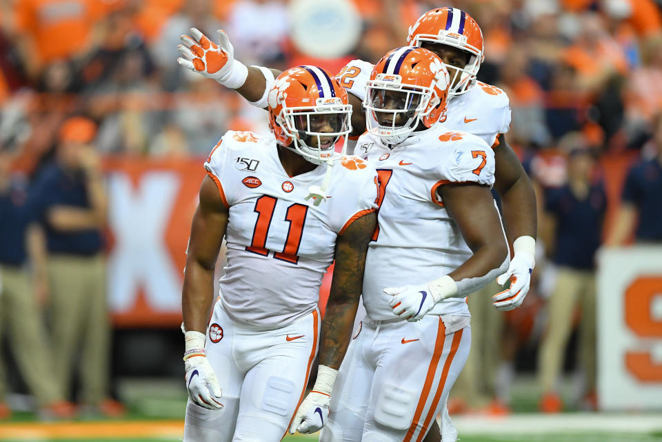 Clemson Tigers linebacker Isaiah Simmons (11) reacts to a defensive play with teammates Justin Mascoll (7) and Xavier Kelly (back) against Syracuse on Saturday. (Getty)