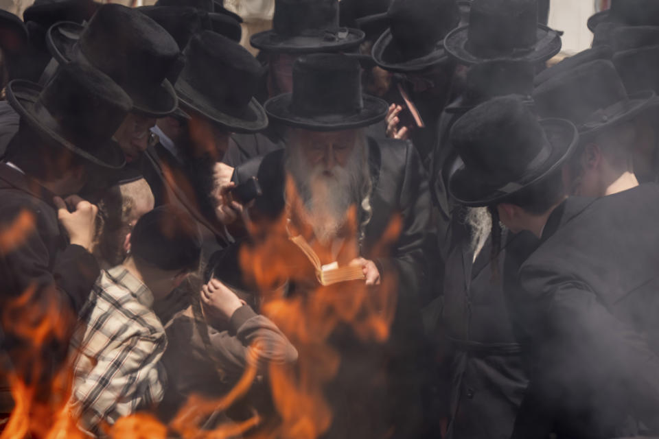 Ultra-Orthodox Jews burn leavened items in final preparation for the Passover holiday in Bnei Brak, near Tel Aviv, Israel, April 22, 2024. (AP Photo/Oded Balilty)