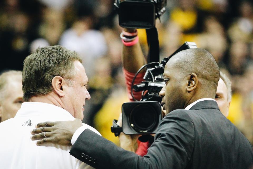 Kansas head coach Bill Self (left) and Missouri head coach Dennis Gates (right) meet after the Tigers' Border War game against Kansas on Dec. 10, 2022, at Mizzou Arena in Columbia, Mo.