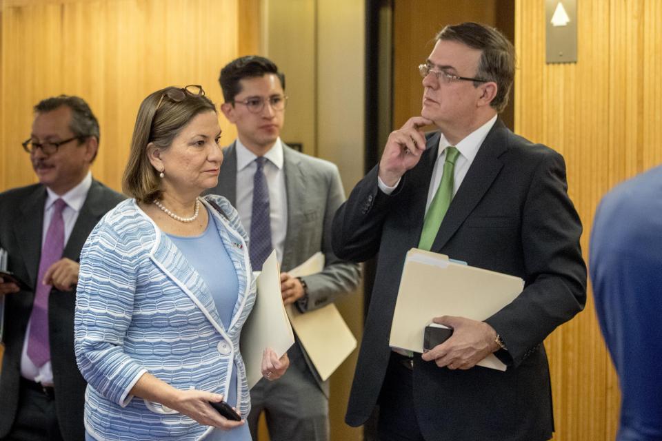 Mexican Ambassador Martha Barcena Coqui, second from left, and Mexican Foreign Affairs Secretary Marcelo Ebrard, right, speak before a news conference at the Mexican Embassy in Washington, Tuesday, June 4, 2019, as part of a Mexican delegation in Washington for talks following trade tariff threats from the Trump Administration. (AP Photo/Andrew Harnik)