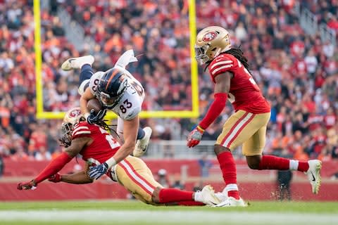 Denver Broncos tight end Matt LaCosse (83) is tackled by San Francisco 49ers cornerback Richard Sherman (25) in front of defensive back Marcell Harris (36) during the fourth quarter at Levi's Stadium - Credit: Kyle Terada/USA TODAY