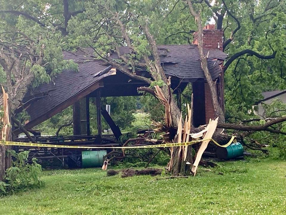 Several trees slammed into a structure at Rotary Park in Livonia as a tornado tore through the western Wayne County community (Nolan Finley/The Detroit News via AP)