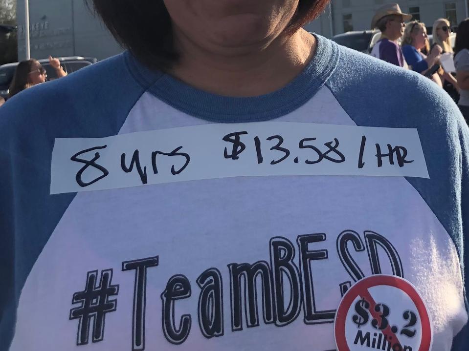 Buckeye educators wore tape with their salary and years of district service as they waited for a Buckeye Elementary School District meeting to begin on May 2, 2022.