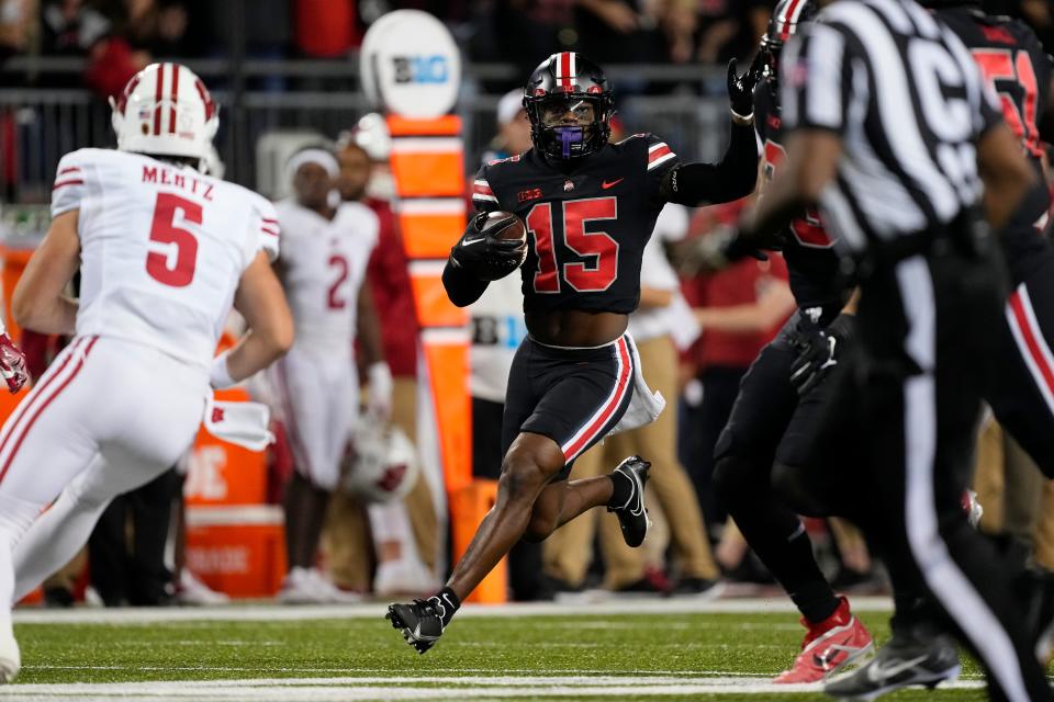 Ohio State safety Tanner McCalister intercepts a pass by Wisconsin quarterback Graham Mertz.