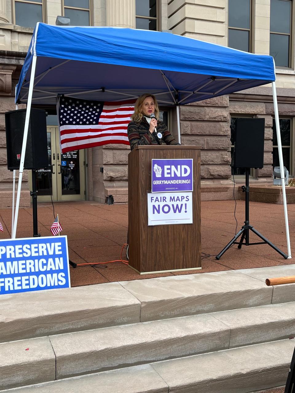 State Rep. Kristina Shelton , D-Green Bay, speaks at a rally Tuesday in Green Bay protesting the state's electoral maps.