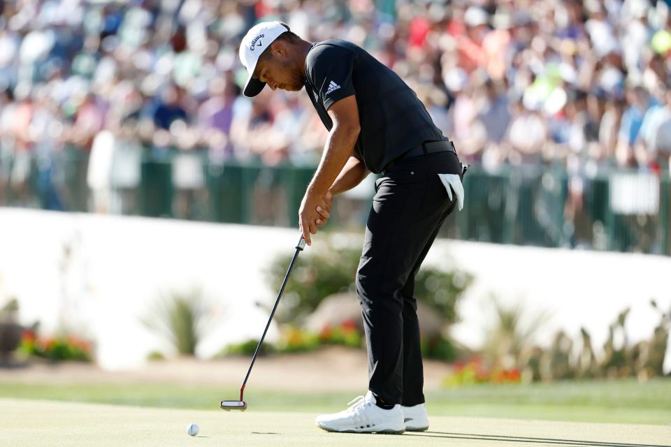 SCOTTSDALE, ARIZONA - FEBRUARY 13: Xander Schauffele of the United States putts on the 16th hole during the final round of the WM Phoenix Open at TPC Scottsdale on February 13, 2022 in Scottsdale, Arizona. (Photo by Christian Petersen/Getty Images)