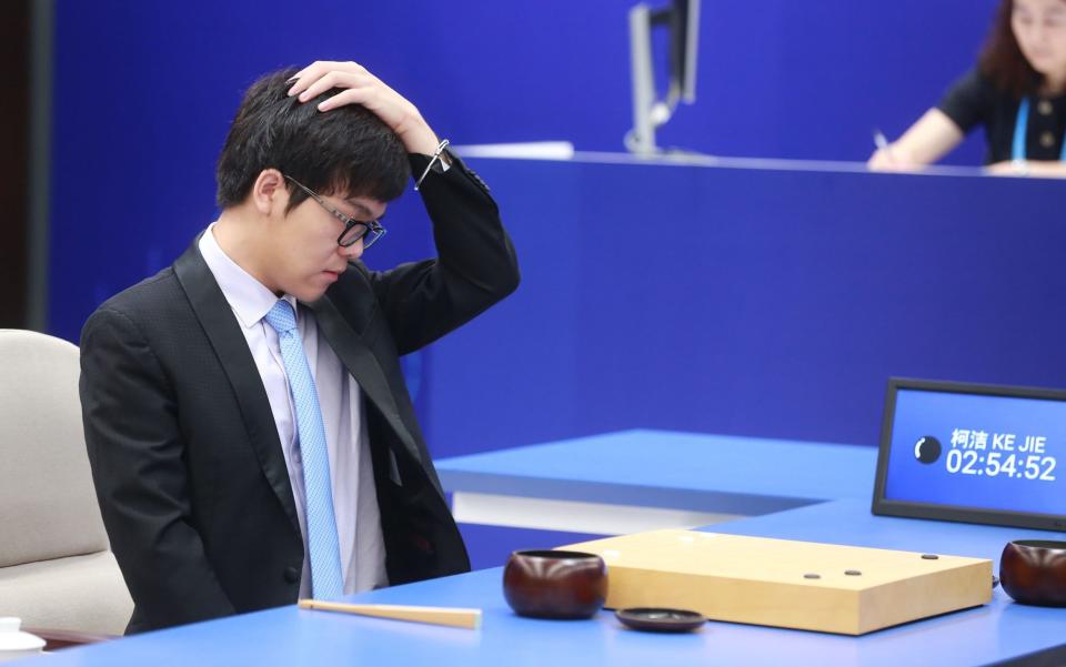 Ke Jie competes against Google's artificial intelligence (AI) program AlphaGo - Credit: Rex