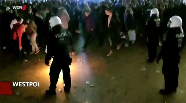 Police struggle to control crowds at Cologne railway station. Photo: Westpol