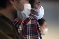 Staff of an artificial intelligence company GumGum Japan work at their office Tuesday, Feb. 25, 2020, in Tokyo. Japanese Prime Minister Shinzo Abe said Tuesday that companies should allow employees to work from home and hospitals must expand their treatment capacity in order for Japan to control its virus outbreak. GumGum Japan, an artificial intelligence company that already allowed flexible hours, now is telling all of its employees to work from home. It also banned unessential business trips and hopes to communicate with business partners via phone and video conferences. (AP Photo/Eugene Hoshiko)