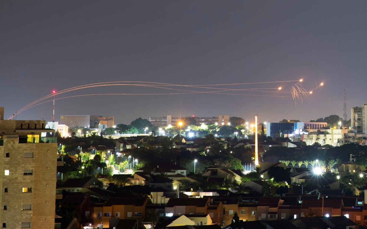 Iron Dome anti-missile system fires interception missiles as rockets are launched from Gaza towards Israel - Reuters