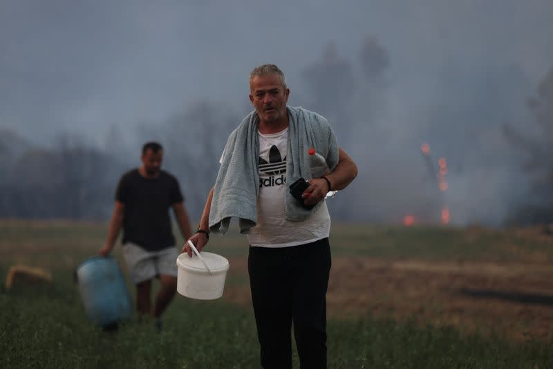 Wildifre burns in the village of Kalfas in southern Greece