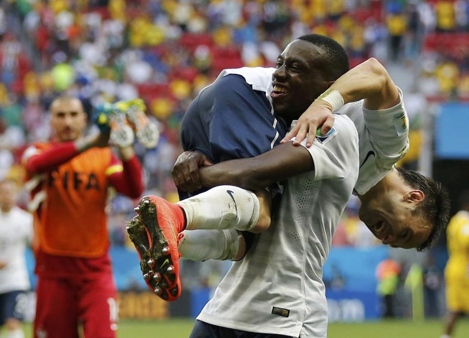 France's Blaise Matuidi (14) and Mathieu Valbuena celebrate after winning their 2014 World Cup round of 16 game against Nigeria at the Brasilia national stadium in Brasilia June 30, 2014. REUTERS/Siphiwe Sibeko