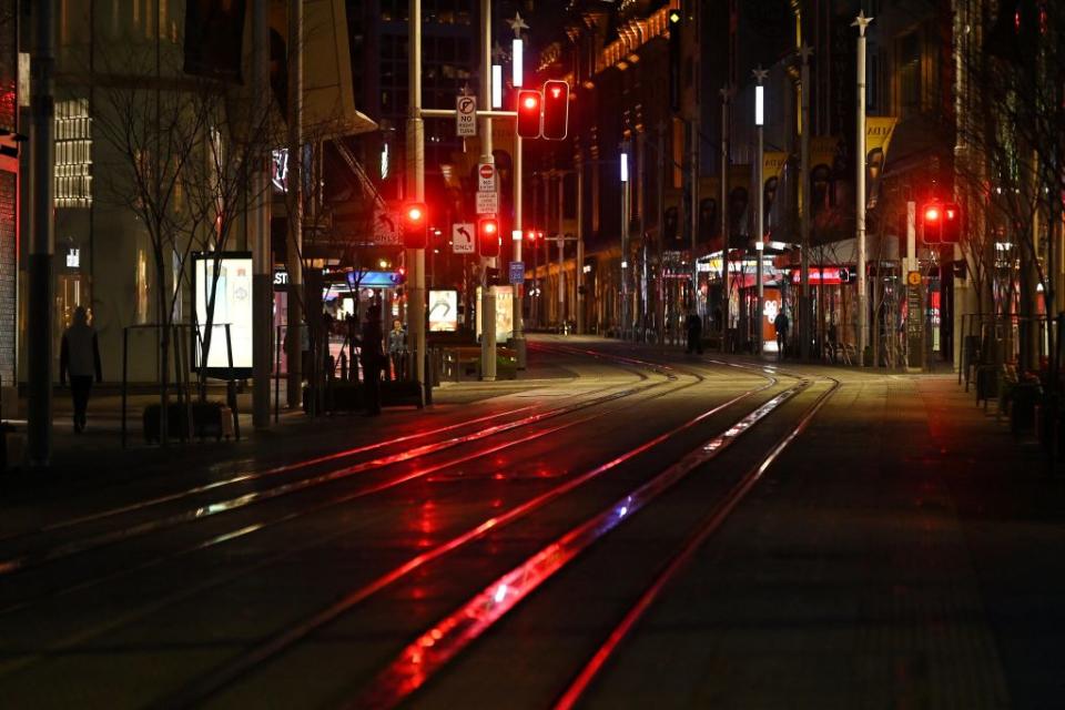 A quiet George Street promenade is pictured on a usually busy evening in Sydney after authorities ordered new restrictions as a weeks-long lockdown failed to quash an outbreak of the Covid-19 coronavirus. 