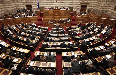 Greece's lawmakers attend a parliament session before a vote for an omnibus reforms bill in Athens March 30, 2014. REUTERS/Alkis Konstantinidis