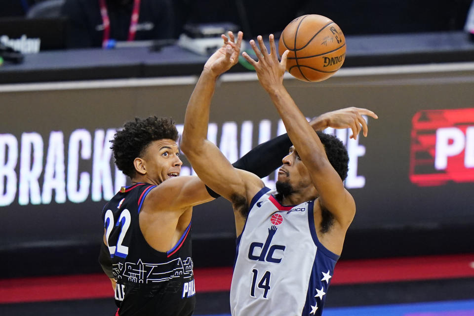 Washington Wizards' Ish Smith (14) cannot get a shot past Philadelphia 76ers' Matisse Thybulle (22) during the second half of Game 2 in a first-round NBA basketball playoff series, Wednesday, May 26, 2021, in Philadelphia. (AP Photo/Matt Slocum)