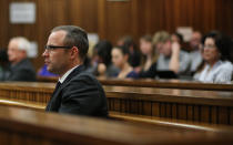 Oscar Pistorius, looks straight ahead during his ongoing murder trial in Pretoria, South Africa, Tuesday, May 13, 2014. Pistorius is charged with the shooting death of his girlfriend Reeva Steenkamp on Valentine's Day in 2013. (AP Photo/Themba Hdebe, Pool)