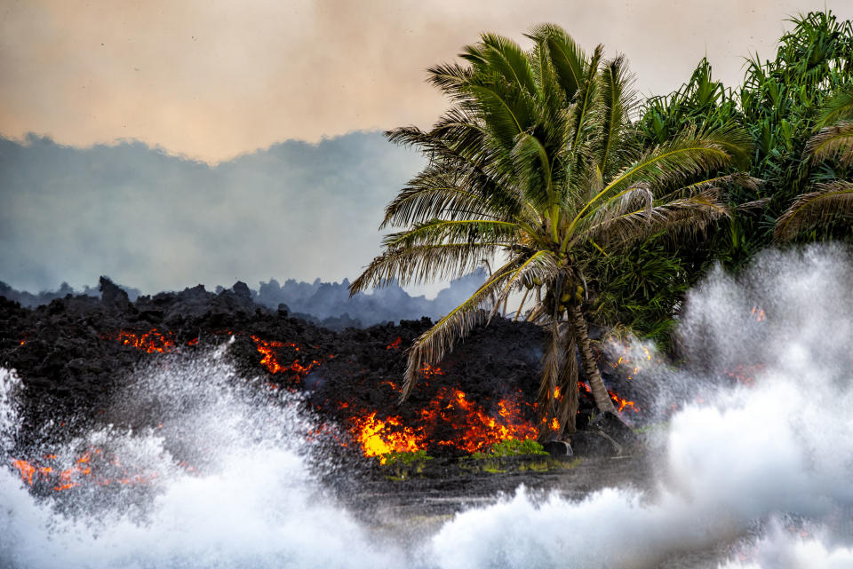 <p>“I am filled with sadness and joy at the same time. This is the duality that is the volcano.” (Photo: CJ Kale/Caters News) </p>