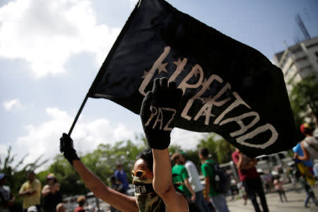 A demonstrator holds up a black flag during an opposition rally in Caracas, Venezuela April 6, 2017. REUTERS/Marco Bello