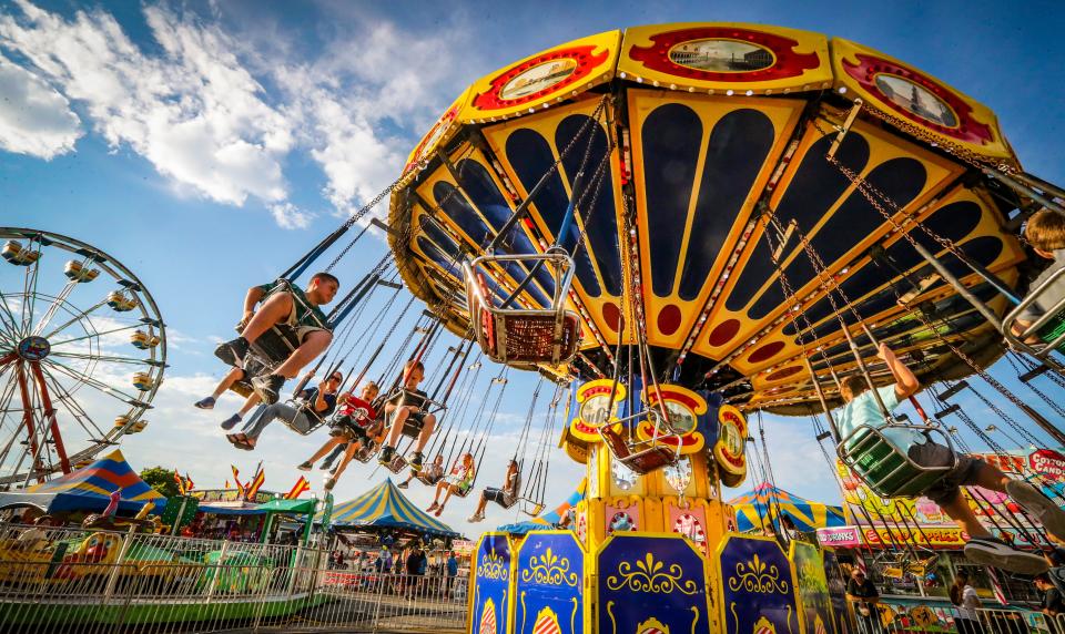 Lndon Pledger of Alva and his brother Ty enjoy the swing ride at the Southwest Florida and Lee County Fair in this 2019 photo.